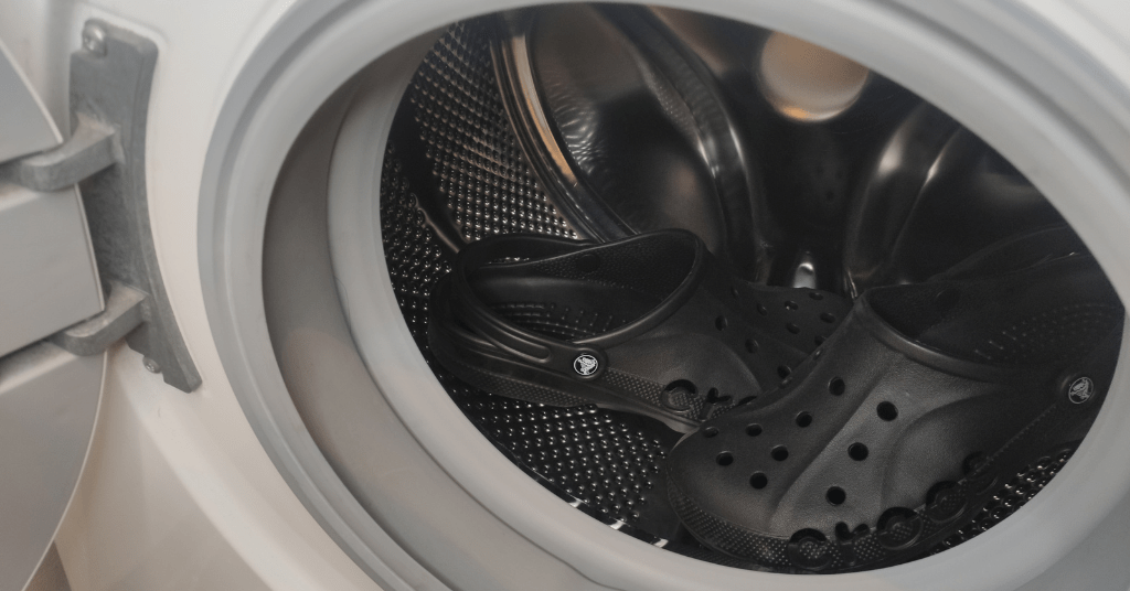 Black croslite Crocs inside the washing machine