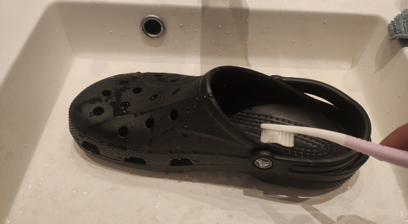 Crocs hand washed in the sink with a toothbrush