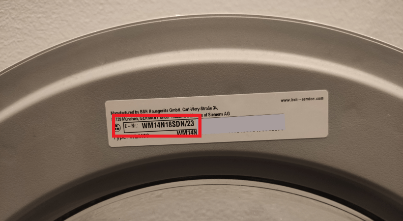 Model number (E-nr) of a washing machine on the inner side of door