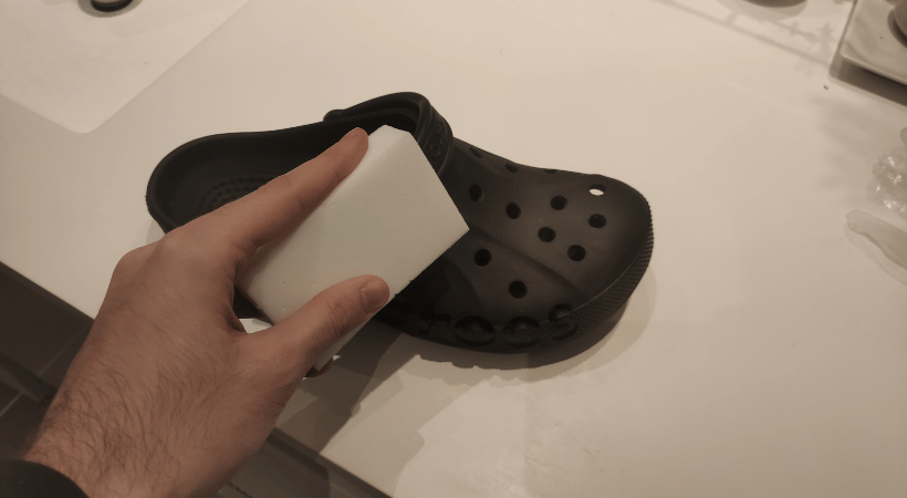Crocs being cleaned with a magic eraser