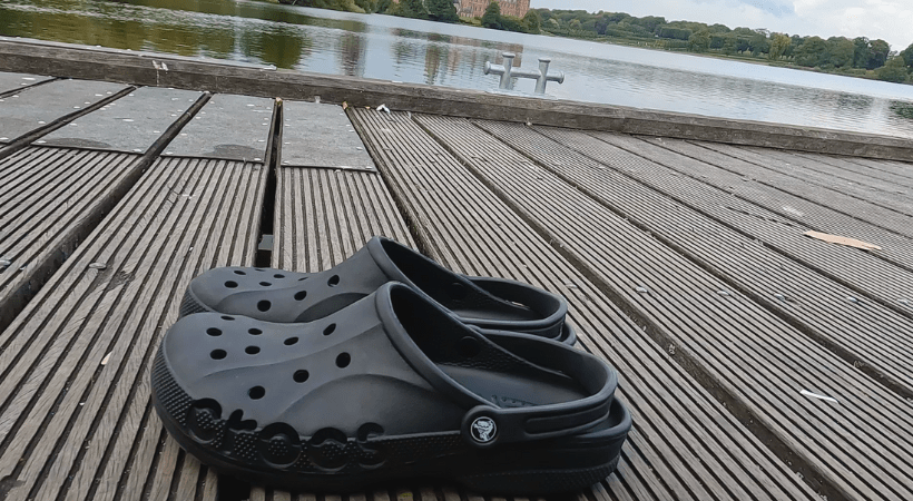 Crocs outside on a water bridge