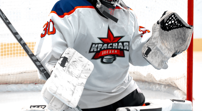 white ice hockey jersey in action