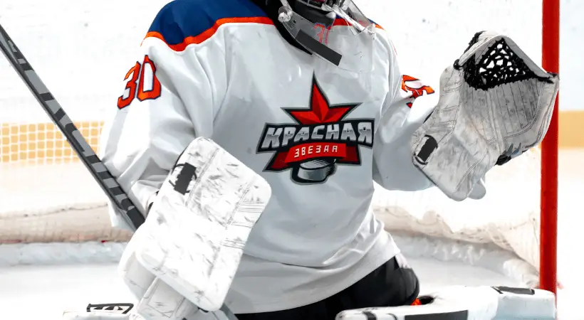 white ice hockey jersey in action